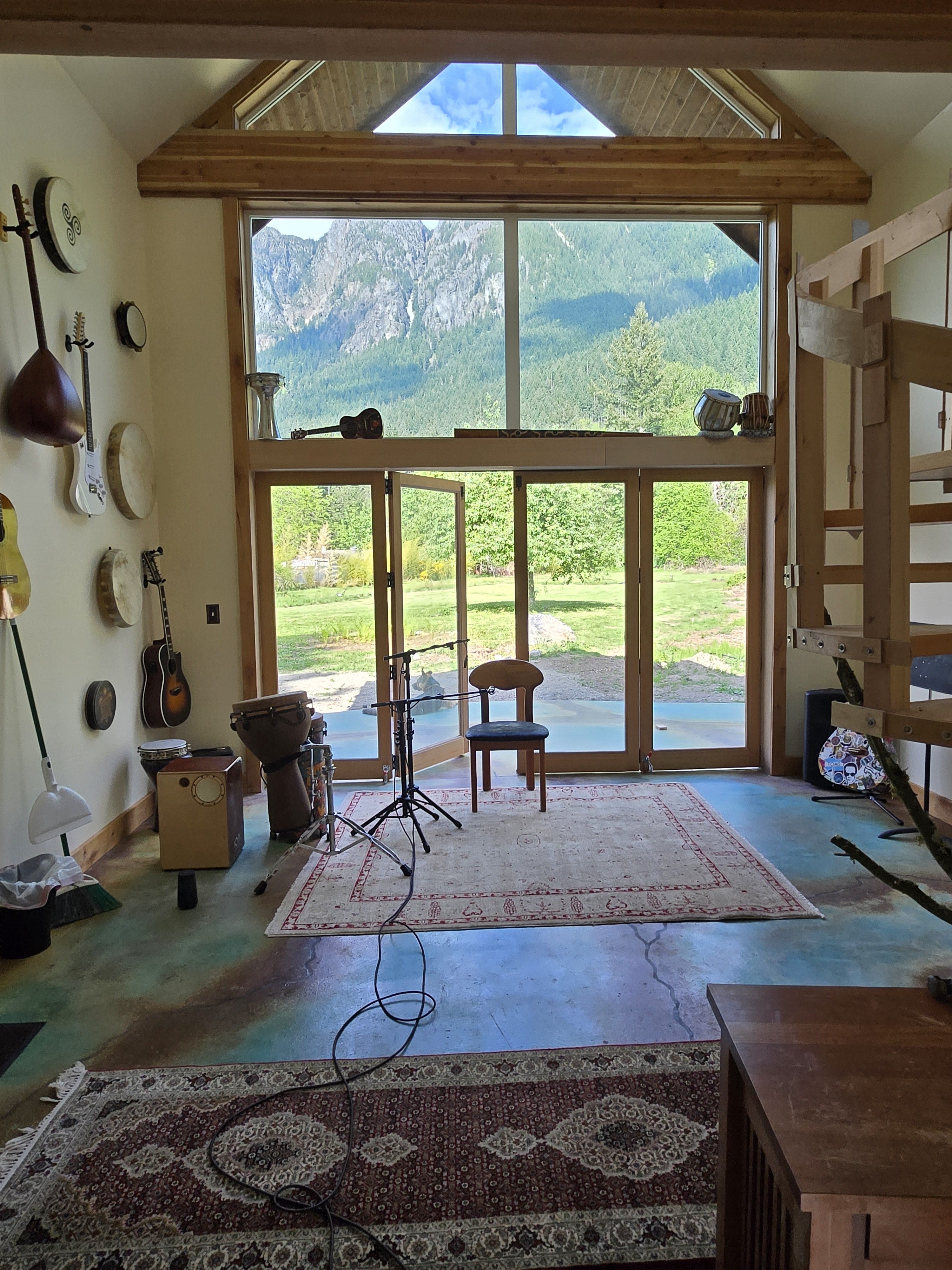 Alpenglow Studio interior — Mount Si framed through full-height windows